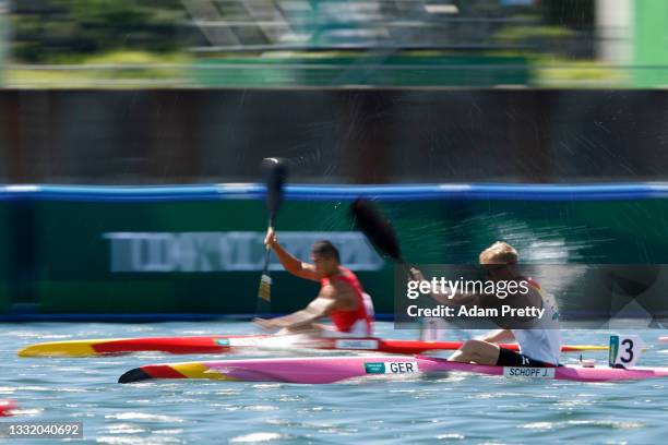 Jacob Schopf of Team Germany competes against Dong Zhang of Team China during the Men's Kayak Single 1000m Semi-final 1 on day eleven of the Tokyo...