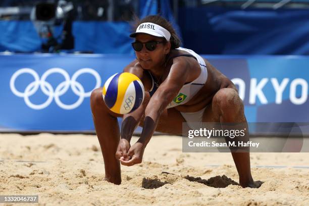 Ana Patricia Silva Ramos of Team Brazil returns the ball against Team Switzerland during the Women's Quarterfinal beach volleyball on day eleven of...