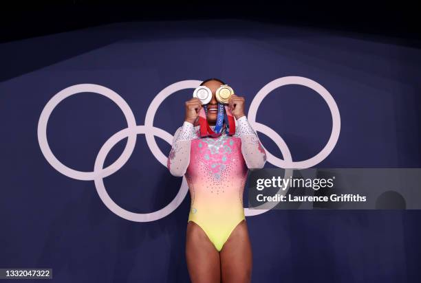 Rebeca Andrade of Team Brazil poses with her women's all-around silver and vault gold medals during on day ten of the Tokyo 2020 Olympic Games at...