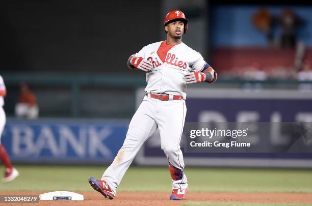 Jean Segura of the Philadelphia Phillies celebrates after driving in a run with a double in the ninth inning against the Washington Nationals at...