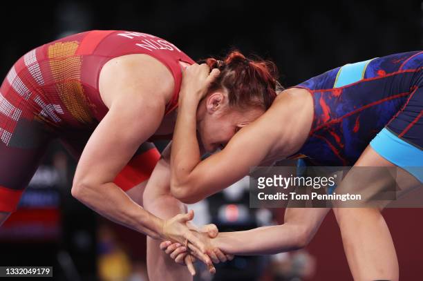 Marianna Sastin of Team Hungary competes against Kriszta Tunde Incze of Team Romania during the Women's Freestyle 62kg 1/8 Final on day eleven of the...