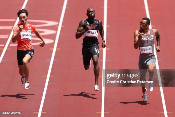 Jun Yamashita of Team Japan, Kyle Greaux of Team Trinidad And Tobago and Andre De Grasse of Team Canada compete in round one of the Men's 200m heats...