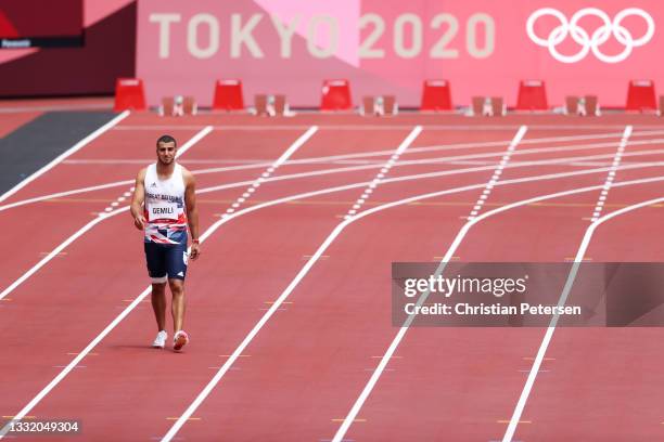 Adam Gemili of Team Great Britain walks during round one of the Men's 200m heats after an apparent injury on day eleven of the Tokyo 2020 Olympic...