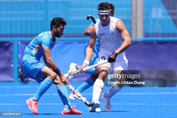 Shamsher Singh of Team India and Alexander Robby P Hendrickx of Team Belgium battle for a loose ball during the Men's Semifinal match between India...