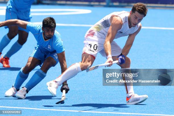 Cedric Daniel Andre Charlier of Team Belgium controls the ball against Varun Kumar of Team India during the Men's Semifinal match between India and...