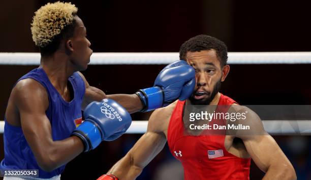 Duke Ragan of Team United States exchanges punches with Samuel Takyi of Team Ghana during the Men's Feather semi final on day eleven of the Tokyo...