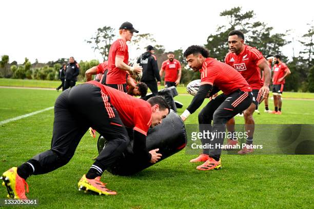 Will Jordan and Richie Mo’unga run through drills during a New Zealand All Blacks training session at Waitakere Stadium on August 03, 2021 in...