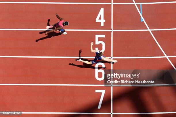 Karsten Warholm of Team Norway finishes first ahead of Rai Benjamin of Team United States in the Men's 400m Hurdles Final on day eleven of the Tokyo...