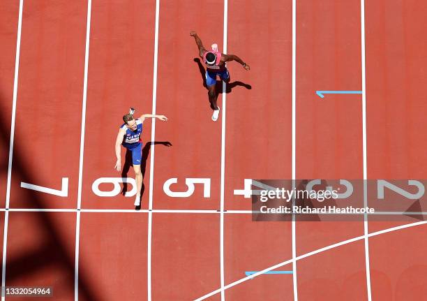 Karsten Warholm of Team Norway finishes first ahead of Rai Benjamin of Team United States in the Men's 400m Hurdles Final on day eleven of the Tokyo...