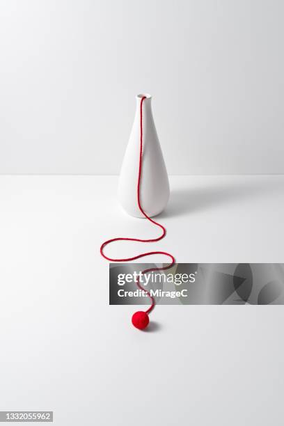 long and curved rope hanging down from white vase - drooping stock pictures, royalty-free photos & images