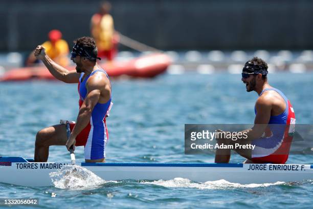Serguey Torres Madrigal and Fernando Dayan Jorge Enriquez of Team Cuba celebrate their gold medal in the Men's Canoe Double 1000m Final A on day...