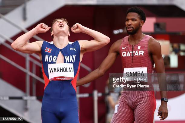 Karsten Warholm of Team Norway and Abderrahman Samba of Team Qatar react after competing in the Men's 400m Hurdles Final on day eleven of the Tokyo...