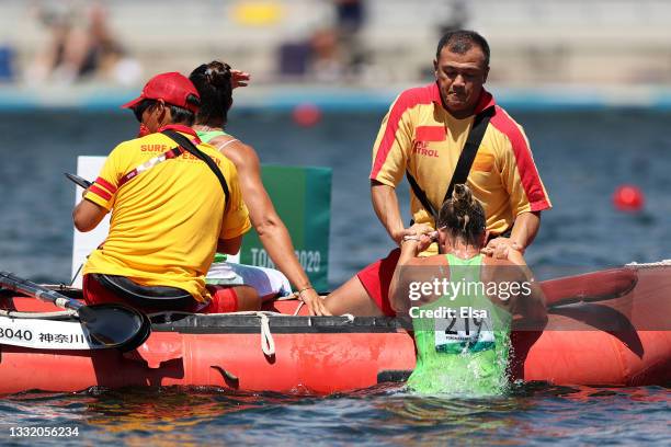 Spela Ponomarenko Janic of Team Slovenia is helped after flipping her boat during the Women's Kayak Double 500m Semi-final 1 on day eleven of the...