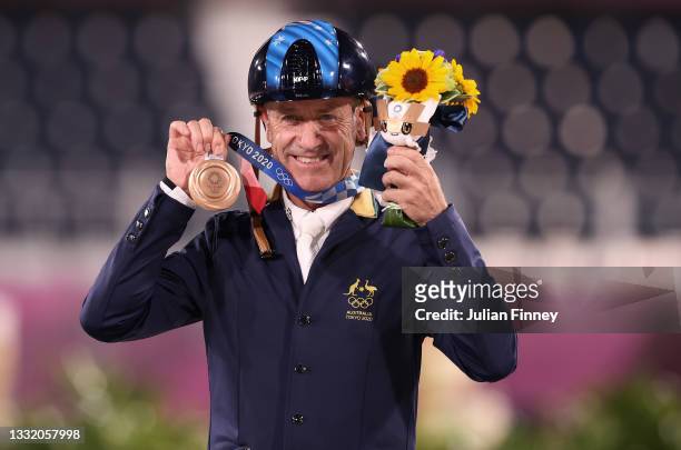 Bronze medalist Andrew Hoy of Team Australia poses with the bronze medal during the Eventing Individual Jumping medal ceremony on day ten of the...