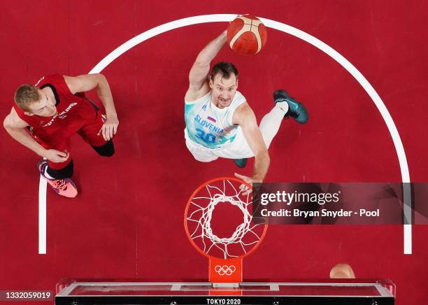 Zoran Dragic of Team Slovenia goes up for a rebound against Niels Giffey of Team Germany during the first half of a Men's Basketball Quarterfinal...