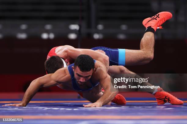 Artem Surkov of ROC competes against Parviz Nasibov of Team Ukraine during the Men's Greco-Roman 67kg Quarter Final on day eleven of the Tokyo 2020...