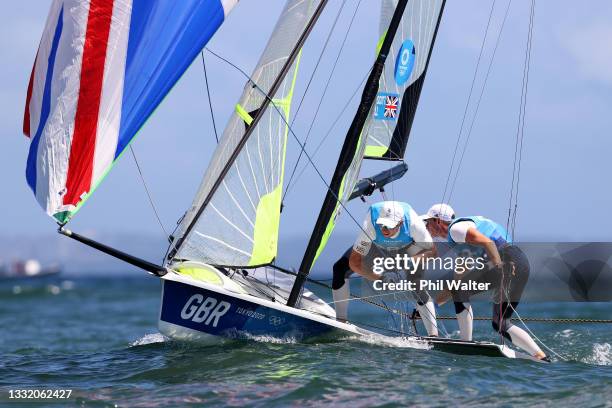 Dylan Fletcher and Stuart Bithell of Team Great Britain compete on their way to winning gold in the Men's Skiff 49er class medal race on day eleven...