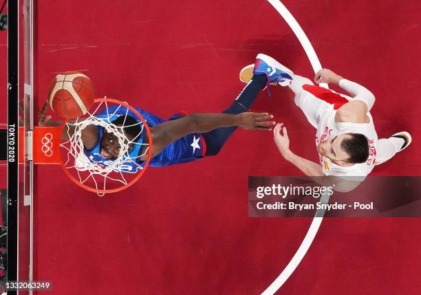 Draymond Green of Team United States drives to the basket against Victor Claver of Team Spain during the first half of a Men's Basketball...