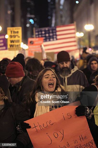 Demonstrators march through downtown during a protest organized by Occupy Chicago and Stand Up Chicago November 17, 2011 in Chicago, Illinois....