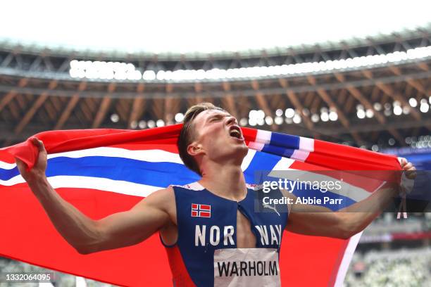 Karsten Warholm of Team Norway celebrates after winning gold in the Men's 400m Hurdles Final on day eleven of the Tokyo 2020 Olympic Games at Olympic...