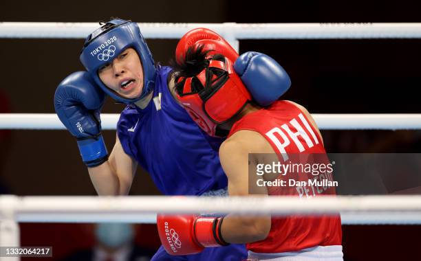 Nesthy Petecio of Team Philippines exchanges punches with Sena Irie of Team Japan during the Women's Feather final on day eleven of the Tokyo 2020...