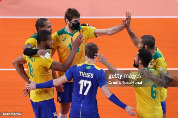 Team Brazil celebrates after the point against Team Japan during the Men's Quarterfinals volleyball on day eleven of the Tokyo 2020 Olympic Games at...