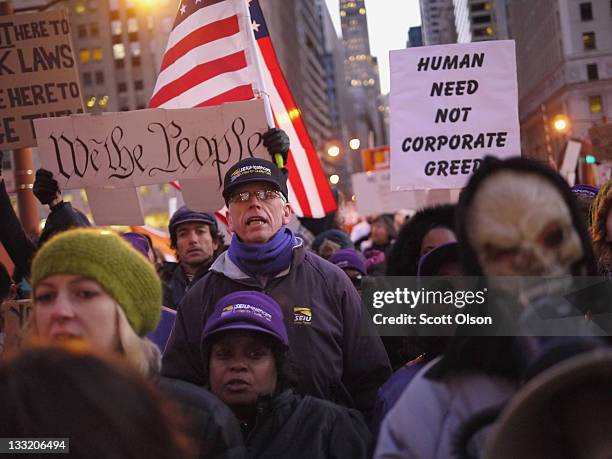 Protesters organized by Occupy Chicago and Stand Up Chicago march through downtown November 17, 2011 in Chicago, Illinois. Forty-six people were...