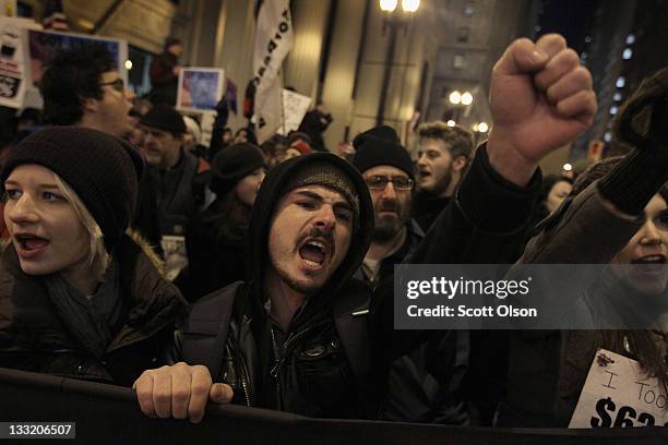 Protesters organized by Occupy Chicago and Stand Up Chicago march through downtown November 17, 2011 in Chicago, Illinois. Forty-six people were...