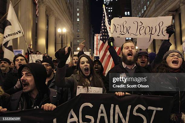 Protesters organized by Occupy Chicago and Stand Up Chicago march through downtown November 17, 2011 in Chicago, Illinois. Forty-six people were...