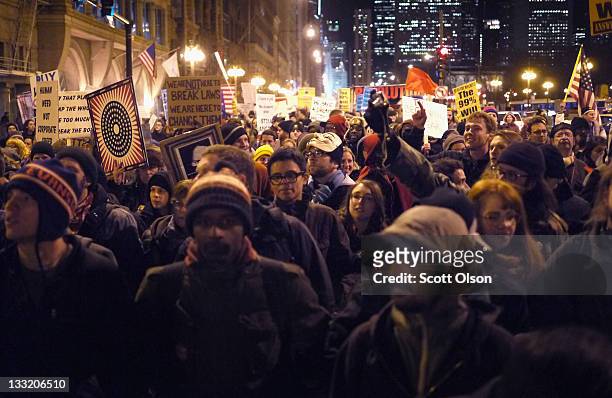 Protesters organized by Occupy Chicago and Stand Up Chicago march through downtown November 17, 2011 in Chicago, Illinois. Forty-six people were...