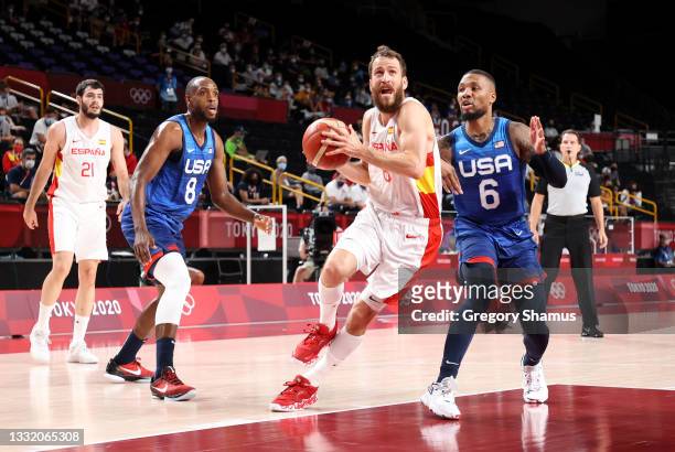 Sergio Rodriguez of Team Spain drives to the basket against Damian Lillard of Team United States during the first half of a Men's Basketball...