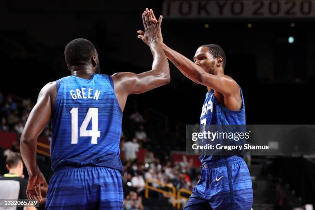 Kevin Durant and Draymond Green of Team United States celebrate a play against Spain during the first half of a Men's Basketball Quarterfinal game on...