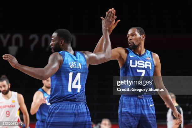 Draymond Green of Team United States high-fives teammate Kevin Durant during the first half of their Men's Basketball Quarterfinal game against Spain...