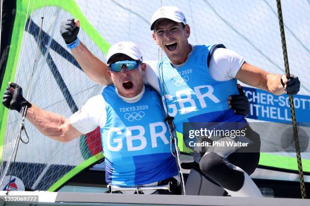 Dylan Fletcher and Stuart Bithell of Team Great Britain celebrate as they win gold in the Men's Skiff 49er class on day eleven of the Tokyo 2020...