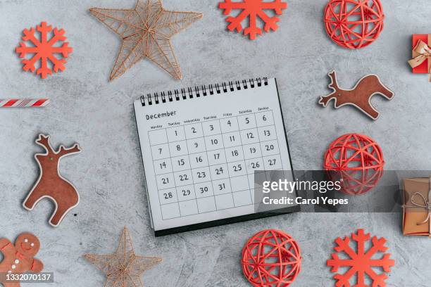 flat lay december calendar with christmas ornaments - season schedule announcement stock pictures, royalty-free photos & images