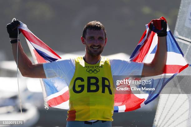 Giles Scott of Team Great Britain celebrates after winning gold in the Men's Finn class on day eleven of the Tokyo 2020 Olympic Games at Enoshima...