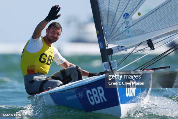 Giles Scott of Team Great Britain celebrates after winning gold in the Men's Finn class on day eleven of the Tokyo 2020 Olympic Games at Enoshima...