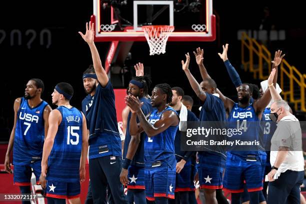 The USA team waves to the fans as they celebrate victory after winning the quarter final Basketball match between the USA and Spain on day eleven of...