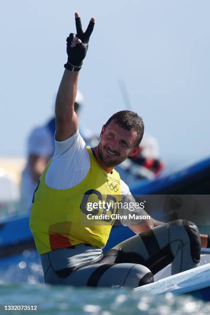 Giles Scott of Team Great Britain celebrates after winning gold in the Men's Finn class on day eleven of the Tokyo 2020 Olympic Games at Enoshima...