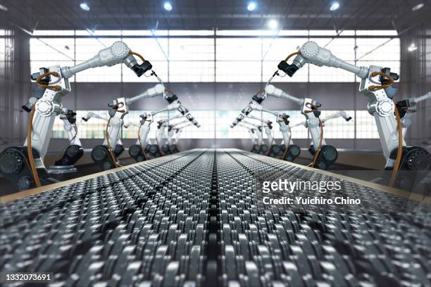 robotic arm in assembly manufacturing factory - herstellendes gewerbe stock-fotos und bilder