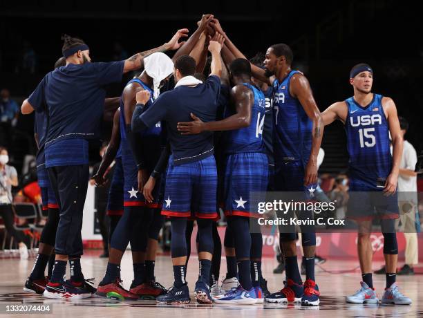 Members of Team United States celebrate a win against Spain following a Men's Basketball Quarterfinal game on day eleven of the Tokyo 2020 Olympic...