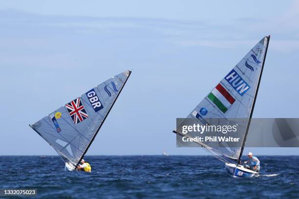 Giles Scott of Team Great Britain and Zsombor Berecz of Team Hungary compete in Men's Finn class on day eleven of the Tokyo 2020 Olympic Games at...