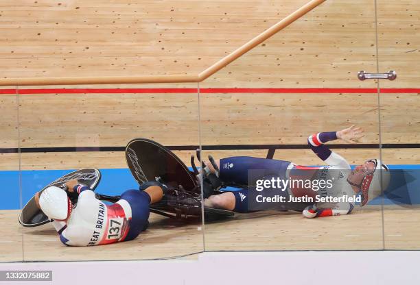 Neah Evans and Katie Archibald of Team Great Britain fall during the celebration after to setting a new Olympic record during the Women's team...