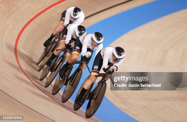 Franziska Brausse, Lisa Brennauer, Lisa Klein and Mieke Kroeger of Team Germany sprint to setting a new Olympic record during the Women's team...