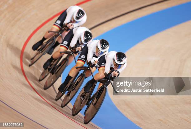 Franziska Brausse, Lisa Brennauer, Lisa Klein and Mieke Kroeger of Team Germany sprint to setting a new Olympic record during the Women's team...