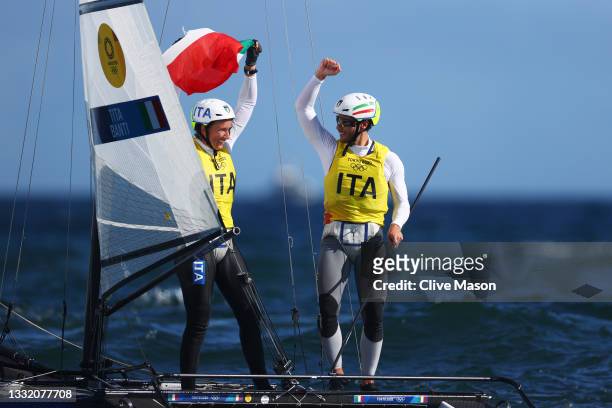 Ruggero Tita and Caterina Banti of Team Italy celebrate winning the Nacra 17 Foiling class on day eleven of the Tokyo 2020 Olympic Games at Enoshima...