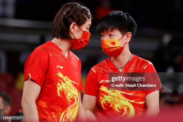 Chen Meng and Sun Yingsha of Team China speak on the sidelines during their Women's Team Quarterfinal table tennis matchon day eleven of the Tokyo...