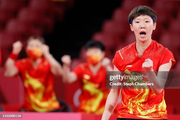 Wang Manyu of Team China reacts during her Women's Team Quarterfinal table tennis match on day eleven of the Tokyo 2020 Olympic Games at Tokyo...