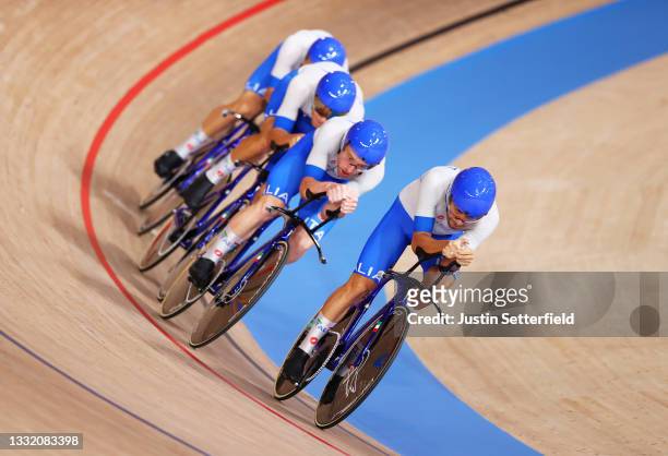 Francesco Lamon, Simone Consonni of Team Italy and teammates sprint to setting a new Olympic record during the Men´s team pursuit first round, heat 3...
