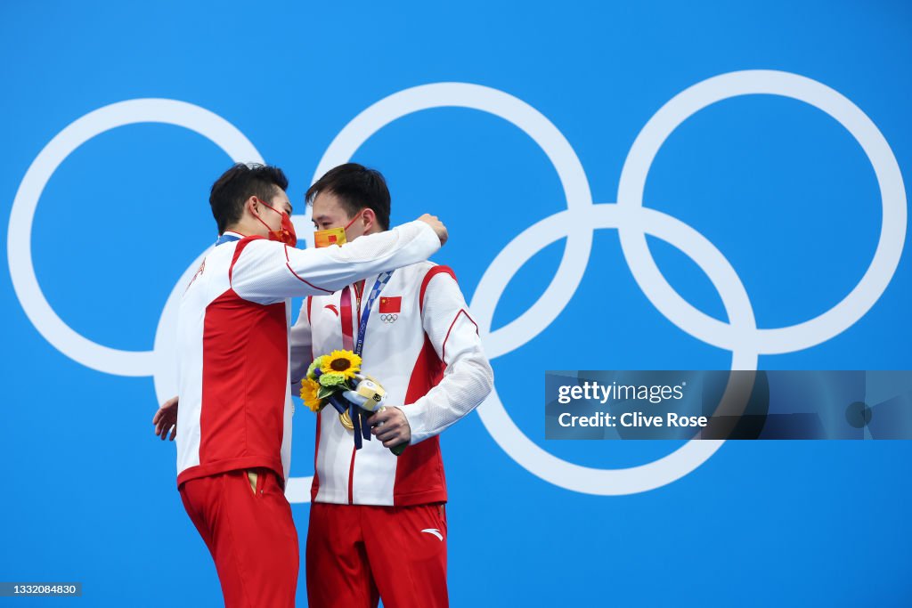 Silver medalist Wang Zongyuan of Team China and gold medalist Xie Silver medalist Wang Zongyuan of Team China and gold medalist Xie
